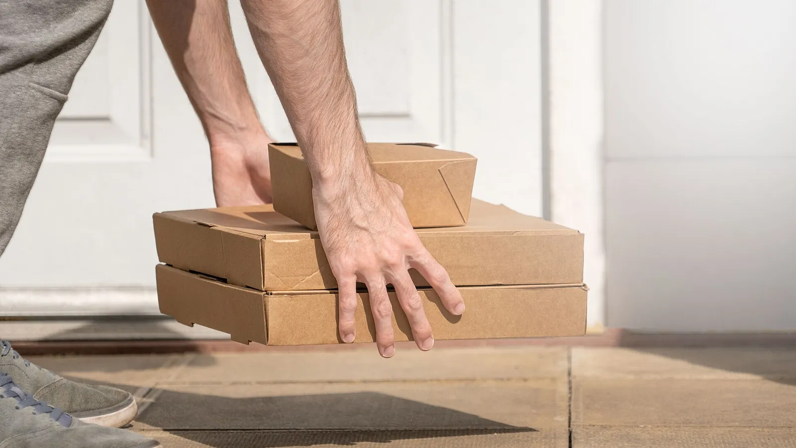 Cardboard packages stacked on a doorstep